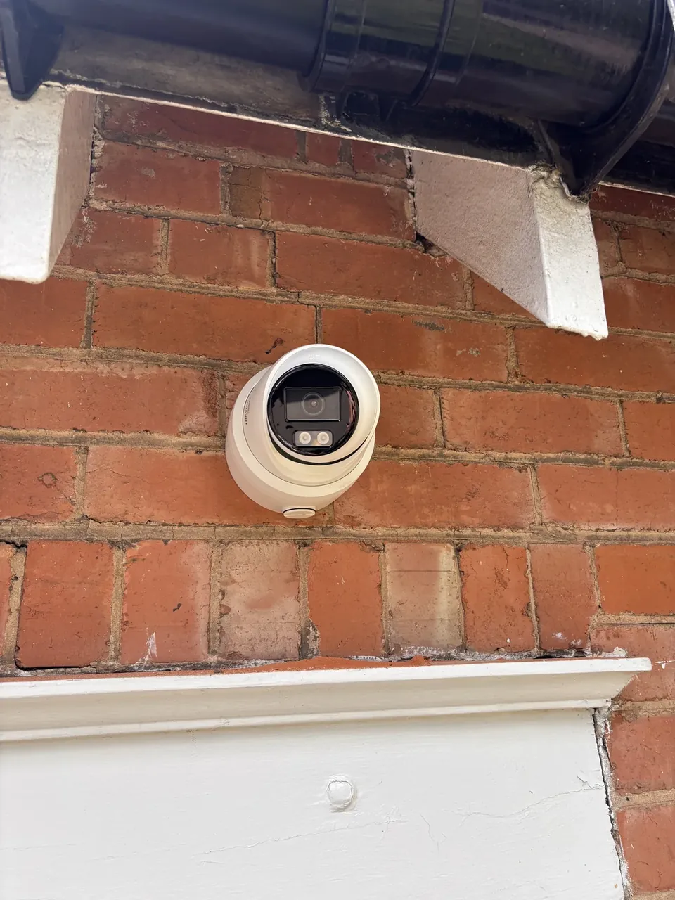 Hik Vision security camera fitted under the eaves