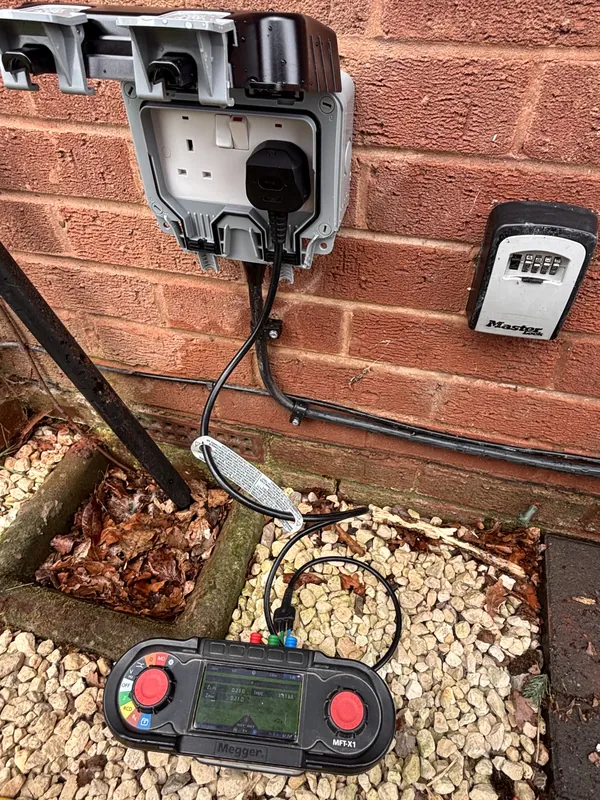 Testing a newly fitted weatherproof outdoor socket