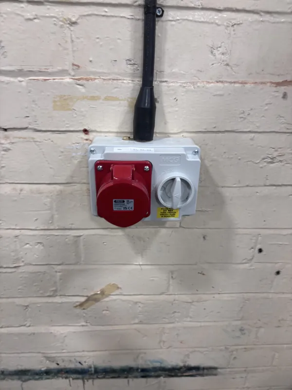 A three-phase socket and isolator on a commercial unit