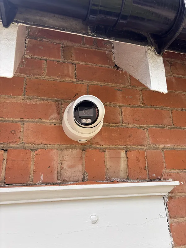 An HD CCTV camera neatly sited under the eaves